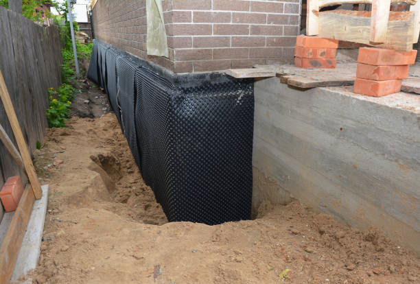 SJ Waterproofing Pros technician performing targeted Exterior Waterproofing assessment in Suwanee, GA